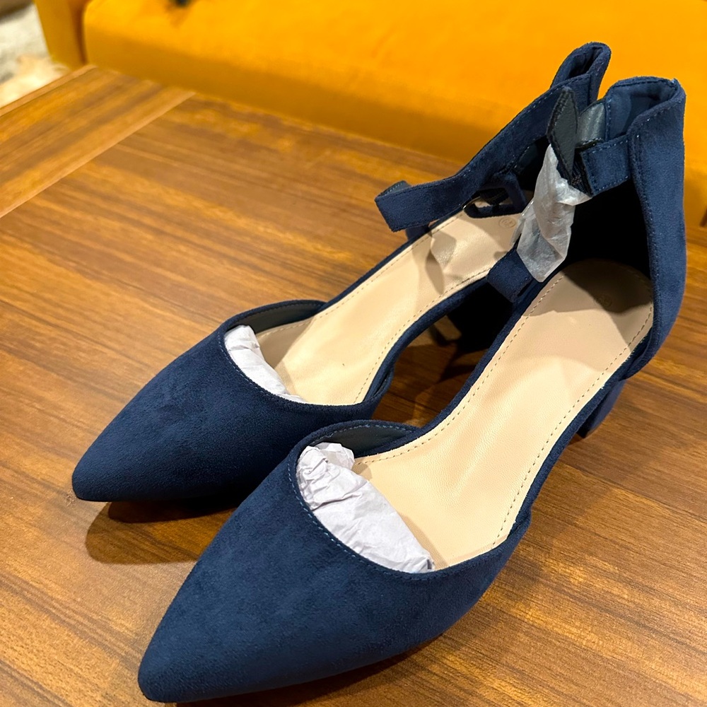 Brand new navy heels. Pointed toe and chunky heel with ankle strap. Very cute!